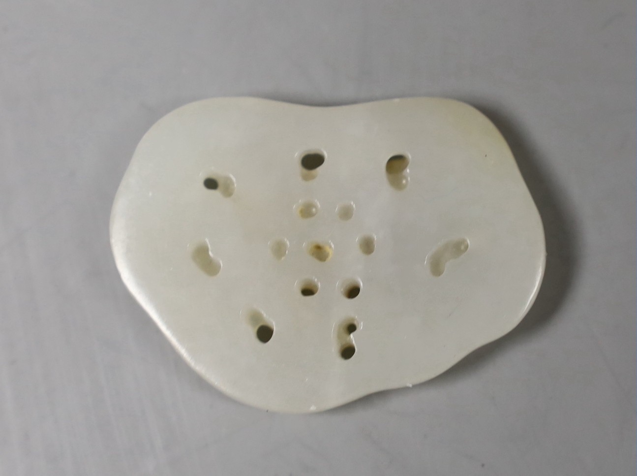 A Chinese white and russet skin jade ‘butterfly’ plaque, 3,5 cms long